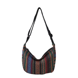 Ethnic bohemian woven tote bag with colorful patterns and adjustable black strap