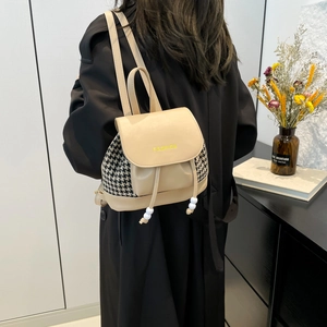 Chic beige leather backpack with houndstooth side panels and drawstring closure