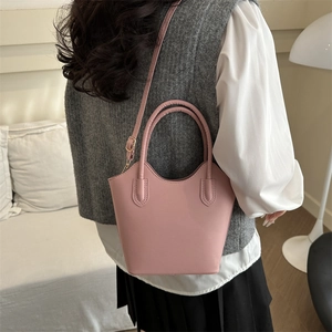 Pink minimalist bucket bag for women with large capacity and adjustable crossbody strap