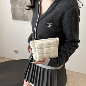 Minimalist cream white quilted pouch with grid pattern and gold zipper closure