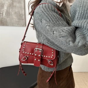 Chic red punk Y2K shoulder bag with silver rivets and buckle detail for women