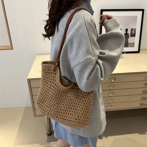 Summer hand-woven straw bucket bag with large capacity and brown crossbody strap