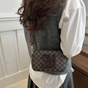 Retro small square crossbody bag with monogram pattern and wide fabric shoulder strap
