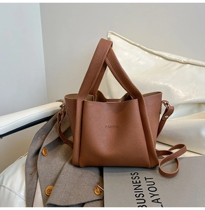 Detail of brown litchi pattern leather texture and Fashion embossing on a bucket bag