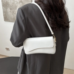 Minimalist white leather underarm bag with asymmetrical flap and gold hardware for women