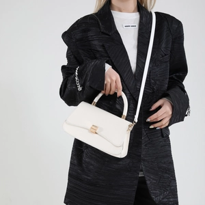 Chic cream white leather shoulder bag with gold hardware and top handle for women