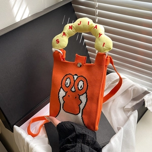 Orange knitted cartoon duck phone bag with yellow cloud handle in a black gift box