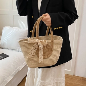 Chic beige woven tote bag with lace bow decoration for summer beach or daily wear