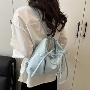 Fashionable light blue bow backpack with long ribbon accents for women in high-quality PU leather