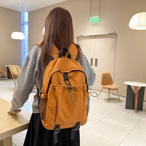 Large ginger yellow casual backpack for students and travel with drawstring pocket and mesh bags