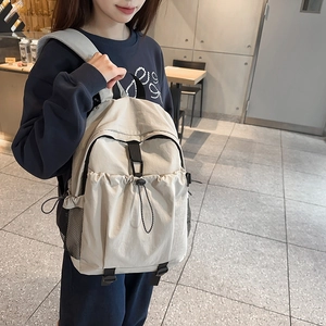 Modern off-white nylon backpack with drawstring front pocket and mesh side pouches