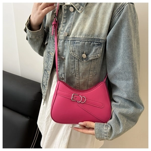 Detailed view of Rose Pink Crescent bag showing smooth leather texture and buckle