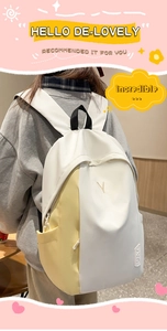 Detail of minimalist white and yellow backpack with embroidered V logo and DAY patch