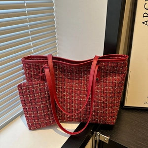 Red tweed tote bag and matching pouch with textured weave and red leather handles