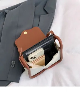 Spacious interior of beige and brown contrast Boston bag showing large storage space