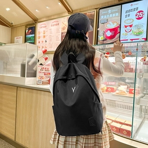 Minimalist black large capacity backpack with Y letter logo and wide straps for students