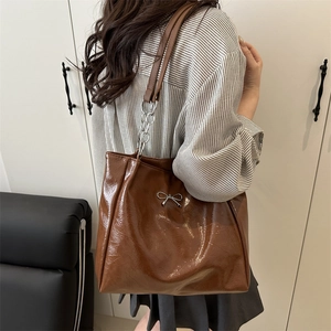 Brown large capacity tote bag with silver bow detail and chain strap for women