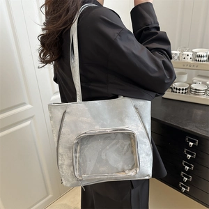 Silver large capacity tote bag with transparent front pocket and metallic finish for commuting