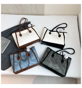 Detailed overhead view of contrast tote bags in four colors with plush bear charms