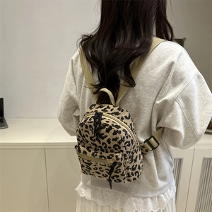Stylish leopard print mini backpack for women made of textured corduroy fabric