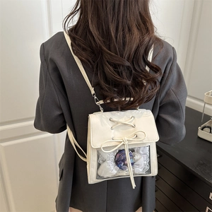 White PU Ita bag with clear window featuring anime badges and ribbon bow detail