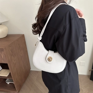 Stylish white hobo shoulder bag for women, minimalist dumpling purse with gold turn-lock.