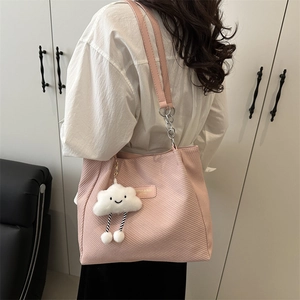 Pink corduroy tote bag for women featuring a metal chain strap and cloud plush pendant