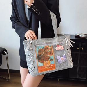 Grey ita tote bag with large clear window and decorative side ribbon bow detailing