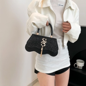 Sparkly black mini handbag with wavy base, metal logo and gold tassel for women