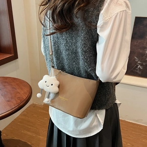 Chic brown PU leather bucket bag with metal chain strap and white plush cloud charm