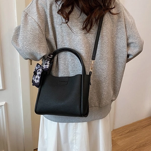 Fashionable black pebbled leather tote bag for women with blue plaid bow silk scarf handle