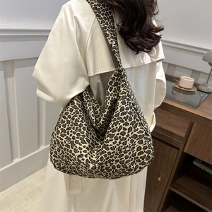 Stylish large leopard print canvas tote bag shown as a casual hobo shoulder bag for women