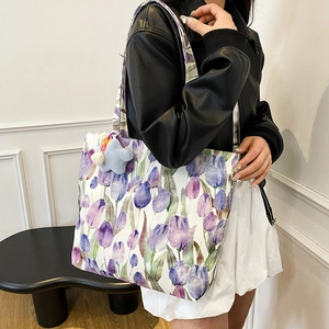 Floral canvas tote bag with purple tulip prints and a star plush charm for women