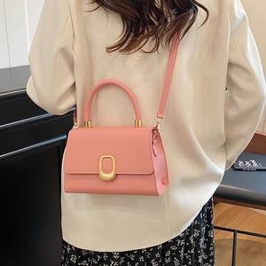 Minimalist pink square handbag with gold buckle and adjustable strap for women