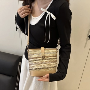 Fashionable straw bucket bag with color-blocking design and metallic turn-lock closure