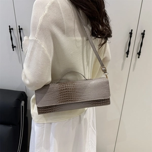 Schicke graue Schultertasche mit Krokodilmuster für Damen im minimalistischen Pendlerstil