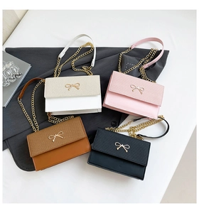 Top view of square chain bags with bow clasp in white, pink, brown, and black