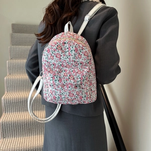 Cute floral backpack for women with pink flower print and white leather straps