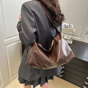 Classic dark brown semi-moon shoulder bag in smooth PU leather with minimalist drape design