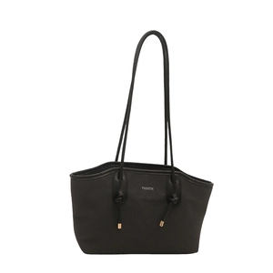 Classic black tote bag with twill texture and golden metal accents on slim straps
