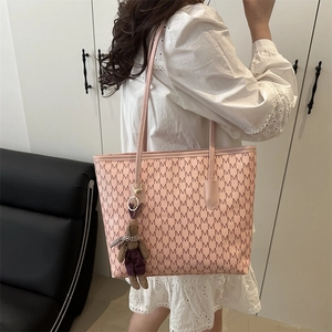 Pink large capacity tote bag with M-pattern print and a cute rabbit charm accessory