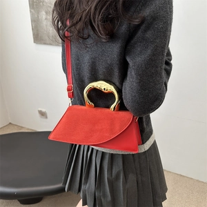 Chic red square handbag with organic gold metal handle and asymmetrical flap for women