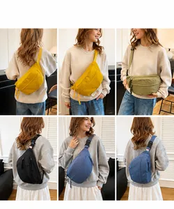 Detail showing various colors of the nylon crossbody bag with adjustable straps on model