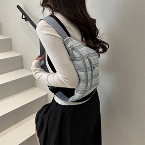Blue and white striped crossbody fanny pack with adjustable strap for women
