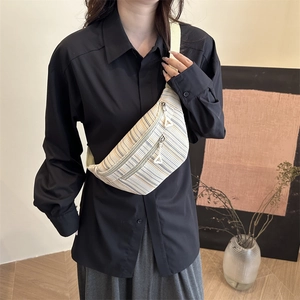 Minimalist striped crossbody chest bag with canvas texture and dual zipper pockets
