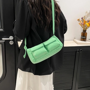 Bright green crossbody shoulder bag with front double pockets in utility style for women