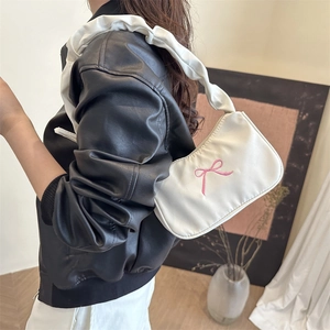 White ruched shoulder bag with pink bow embroidery and stylish pleated cloud strap