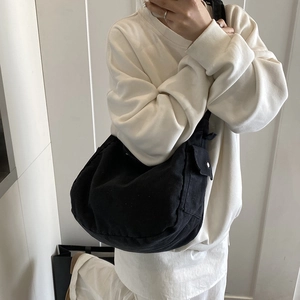 Japanese style black washed denim crossbody bag in hobo style with wide shoulder strap