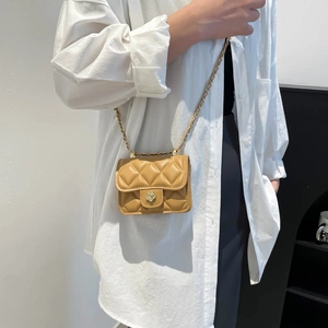 Chic quilted mini crossbody bag with gold flower clasp and leather chain strap