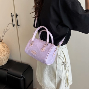 Lavender snake-print Boston bag with top handles and adjustable crossbody strap